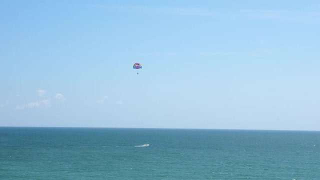 Two people parasailing over the sea. General view. Active vacation.