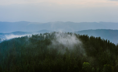Mountain crown in fog