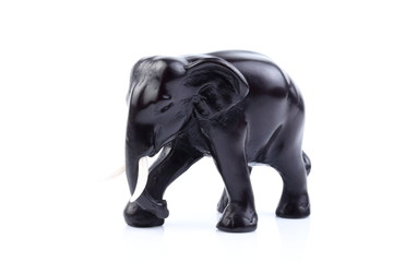 Fototapeta na wymiar Black elephant like wooden carved with white ivory. Stand on white background, Isolated, Art Model Thai Crafts, For decoration Like in the spa.