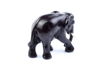Fototapeta na wymiar Black elephant like wooden carved with white ivory. Stand on white background, Isolated, Art Model Thai Crafts, For decoration Like in the spa.