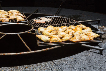 Chicken wings frying outdoors with the heat emanating from a well in a volcano, in Fuerteventuram, Canarias, Spain.