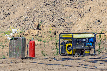 Gasoline generator, canister with gasoline, fire extinguisher