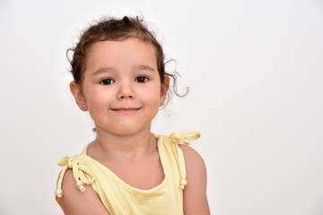 Portrait of a smiling cute young girl. Copy space on the right side. 