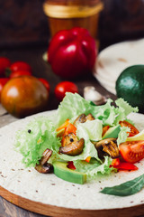 Natural vegetarian mexican food - fresh salad on tortilla bread.