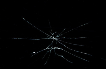 Obraz premium cracks on the glass on a black background