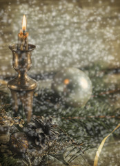  Сandle  and Chrismas decorations over wooden background