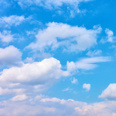 Light blue sky with white heap clouds