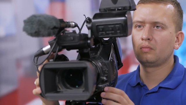 Camera operator working with a cinema broadcast TV camera