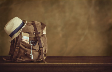 Fototapeta Looking image of the traveling concept, essential vacation items. Backpack.	 obraz