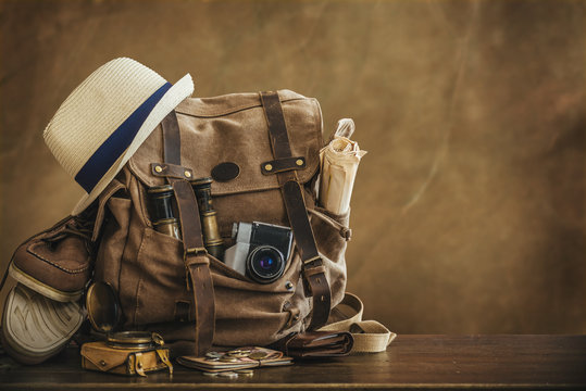 Looking image of the traveling concept, essential vacation items. Backpack. Retro effect.		