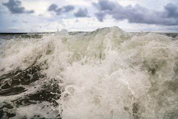 Storm waves on the seashore as a background