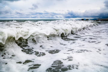 Storm waves on the seashore as a background
