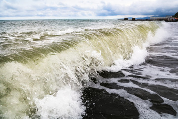 Storm waves on the seashore as a background