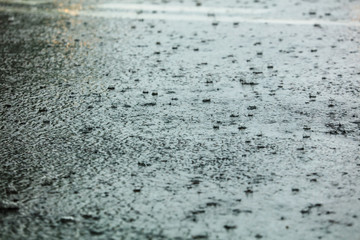 Rain on the asphalt road as background