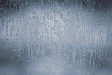 Wetted glass on the window as a background