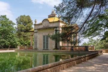 Neoclassical pavilion of Carlos IV and a square pond with fish in the Horta Labyrinth Park. The pavilion was built in 1794 by Domenico Bagutti.