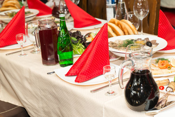 Enjoy a festive table in the restaurant with the red towels on the plates