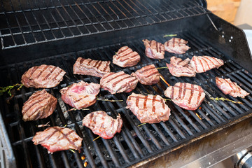 cooking marbled beef on the grill