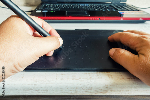 hand uses pen tablet for graphic design draw pad stock photo and