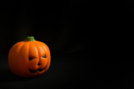 The halloween pumpkin jack in black holiday background image.