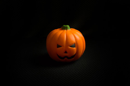 The halloween pumpkin jack in black holiday background image.