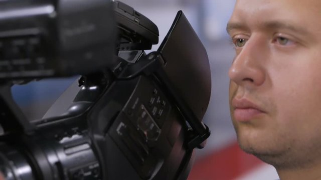 Camera operator working with a cinema broadcast TV camera