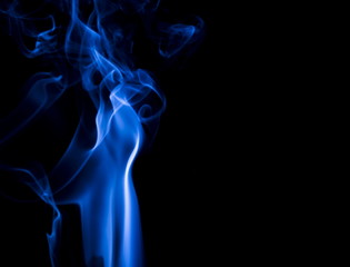 Blue smoke on black background