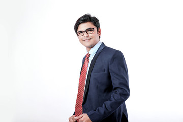 Young Indian businessman over white background