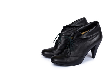 Female black leather high heel shoes isolated on white background, copy space template