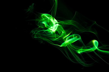 Fototapeta premium Green smoke on black background