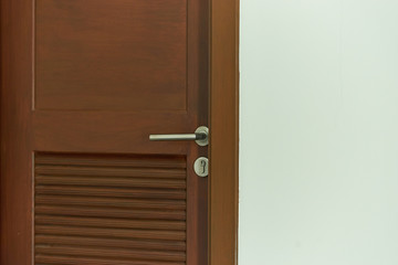 wood door close on white wall cement