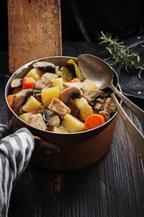 Mushroom stew on black rustic board