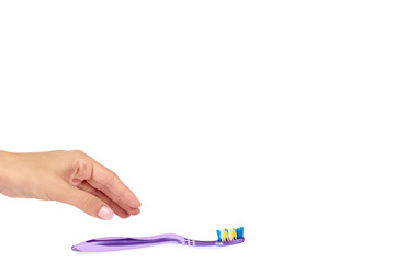 Color new toothbrush with hand isolated on a white background, copy space template.