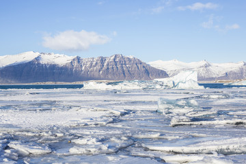 Beautiful cold winter landscape with icebergs in Jökulsárlón glacial lagoon, Vatnajökull National Park, southeast of Iceland, Europe.