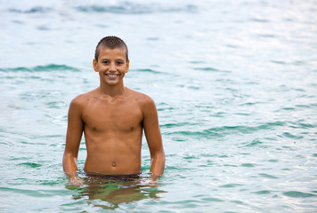 Cheerful boy on the beach