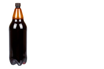 Dark brown plastic bottle of beer or kvass isolated on a white background, copy space template.
