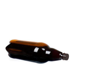 Dark brown plastic bottle of beer or kvass isolated on a white background, copy space template.