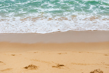 soft wave of an ocean on a sandy beach