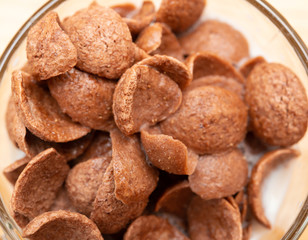 top view cup of milk with cereal slices as healthy eating