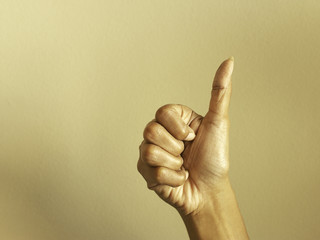 Hand with thumb up gesturing success