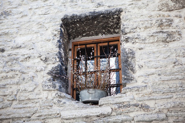 old window and rocky wall