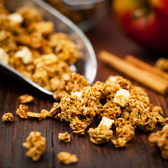 Scoop of Organic Apple Cinnamon Granola. Selective focus.