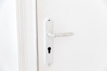 White classic door with handle, keyhole old style