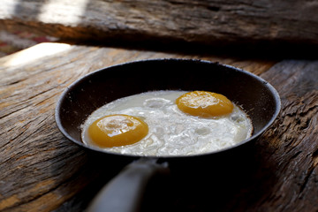 Fried eggs in frying pan