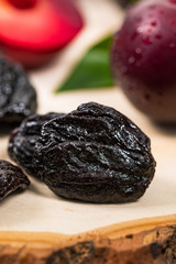 Dried Plums Pitted Prunes and Fresh Plums. Selective focus.