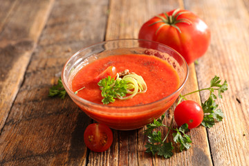 tomato soup on wood background