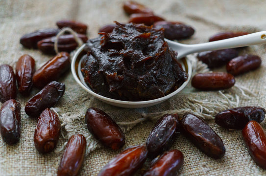 Raw Organic Fresh dates together with fint jam from dates .