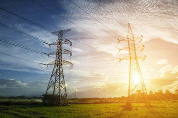 high voltage post,High voltage tower sky sunset background