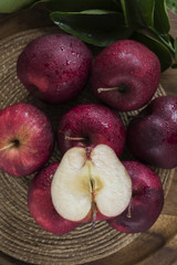 Fresh organic ripe apple fruits on old wooden table.