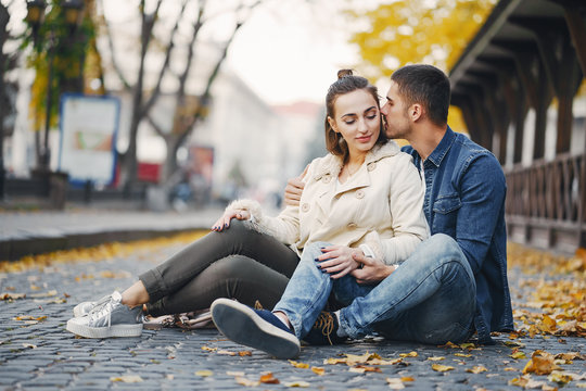 Couple Sitting On The Ground